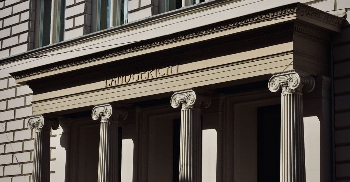 Majestic Neoclassical facade featuring ornate columns and classical architecture.