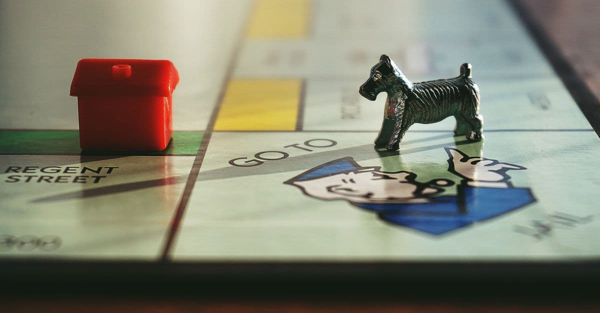 Detailed view of a Monopoly board with tokens on Regent Street.