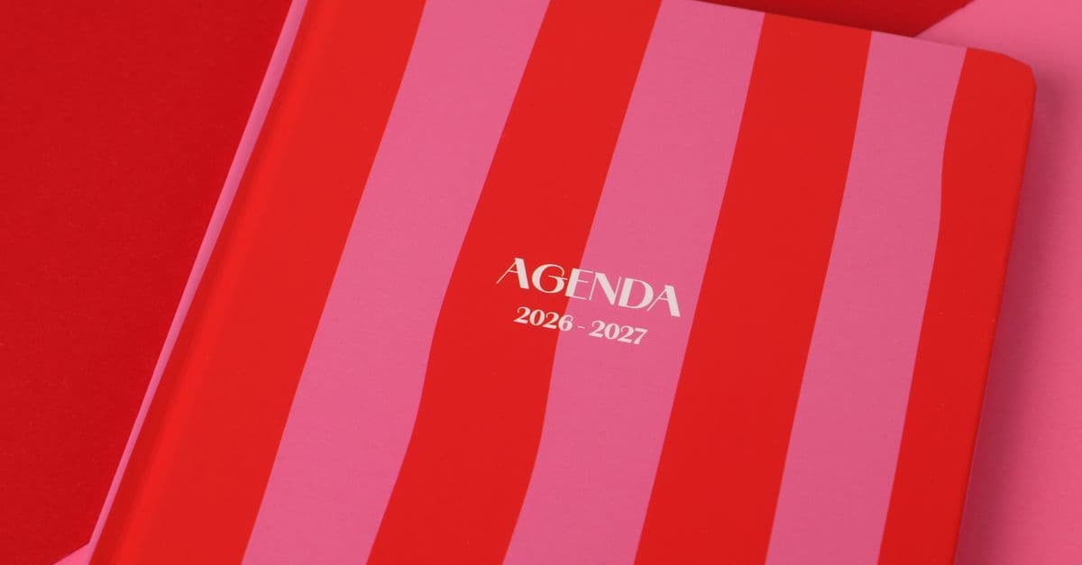 Red and pink striped agenda book for 2026-2027, perfect for planning.